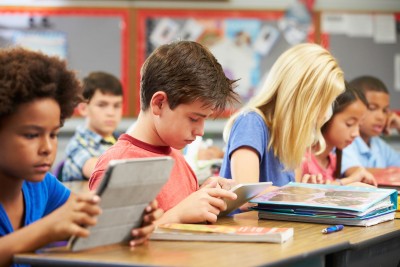 Pupils In class using digital tablets. Source: Thinkstock
