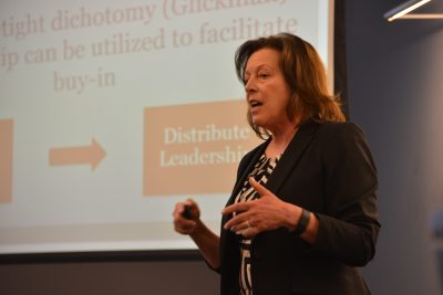 UCAPP student, Margaret Hughes, presents her change project with students and guests. (Photo credit: Shawn Kornegay)