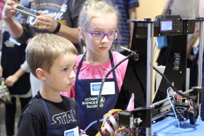 Two children taking part in Science Salon Junior event