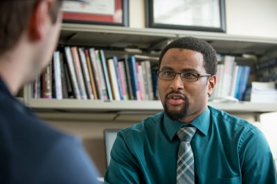 Joseph Cooper meets with student