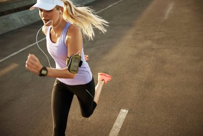 Athlete running with wearable device (iStock image)