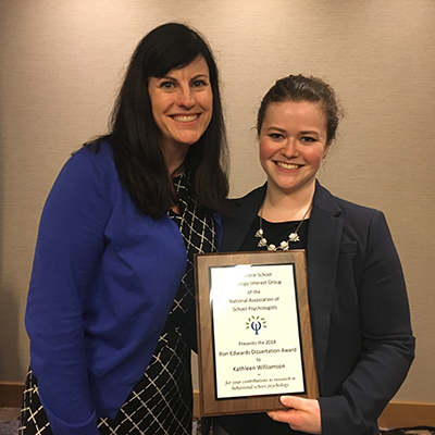 Kathleen Williams (pictured on the right) shows her award with previous faculty advisor, Lisa Sanetti, at the NASP national conference. 