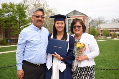 A Class of 2018 Neag School alum celebrates with family at the Undergraduate Commencement Reception on May 6, 2018. (Photo credit: GradImages)