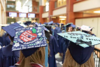 Class of 2018 Neag School grads line up in the Gentry Building in their regalia in preparation for the procession to the Undergraduate Commencement ceremony on May 6, 2018. (Photo credit: Frank Zappulla/Neag School)