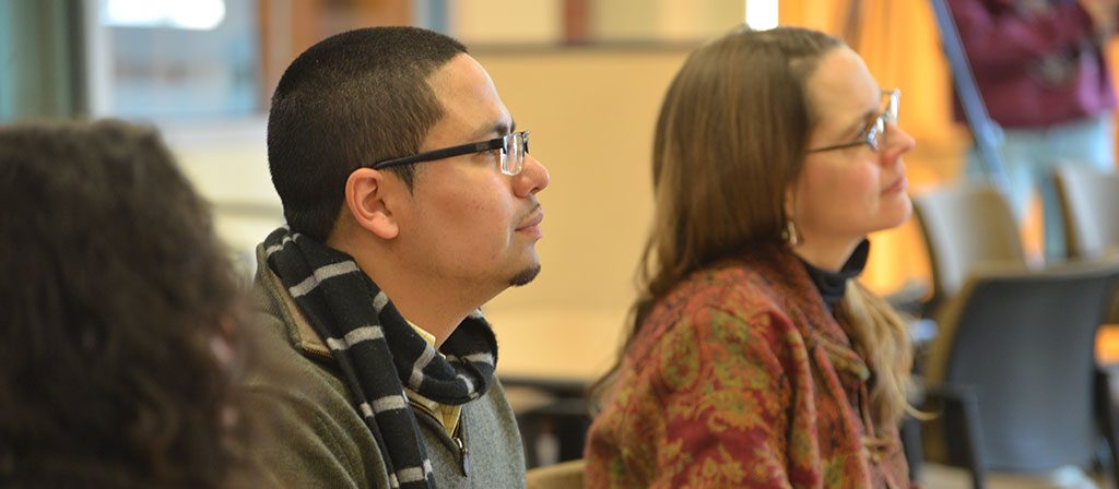 Robert Cotto and Professor Morgaen Donaldson listen to Nathan Jones at CEPA event