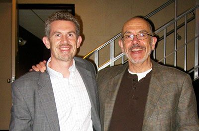 Jason Courtmanche ’91 (CLAS), ’06 Ph.D., left, meets with best-selling author Wally Lamb ’72 (CLAS), ’77 MA. (Photo courtesy of Jason Courtmanche)