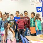 Students at Bowers Elementary School with their teacher, alum Aryliz Estrela.