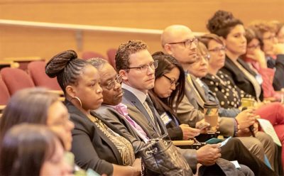 UCAPP students sit in meeting.