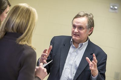 Faculty member, Del Siegle, meets with doctoral students.