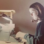 Julie Wood typing on manual typewriter.