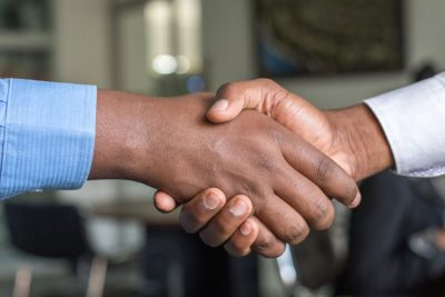 Handshake to illustrate pandemic partnerships.