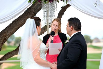 Melissa Thom officiates a wedding ceremony.
