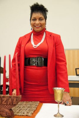 Willena Kimpson Price in a red outfit celebrating Kwanza.