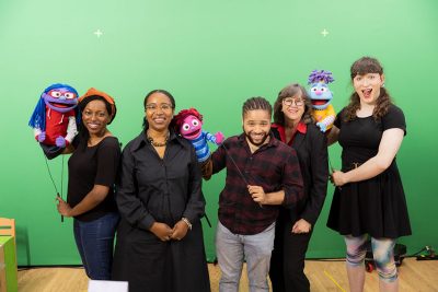 Feel Your Best Self puppeteers, puppets, and funders on green screen.
