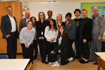 Students from East Hartford High School gather with Superintendent Nathan Quesnel, Dean Jason Irizarry, and Ann Traynor. (Shawn Kornegay/Neag School)